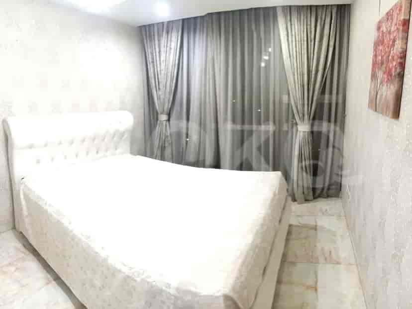 Bedroom with a bed, wardrobe and AC unit.