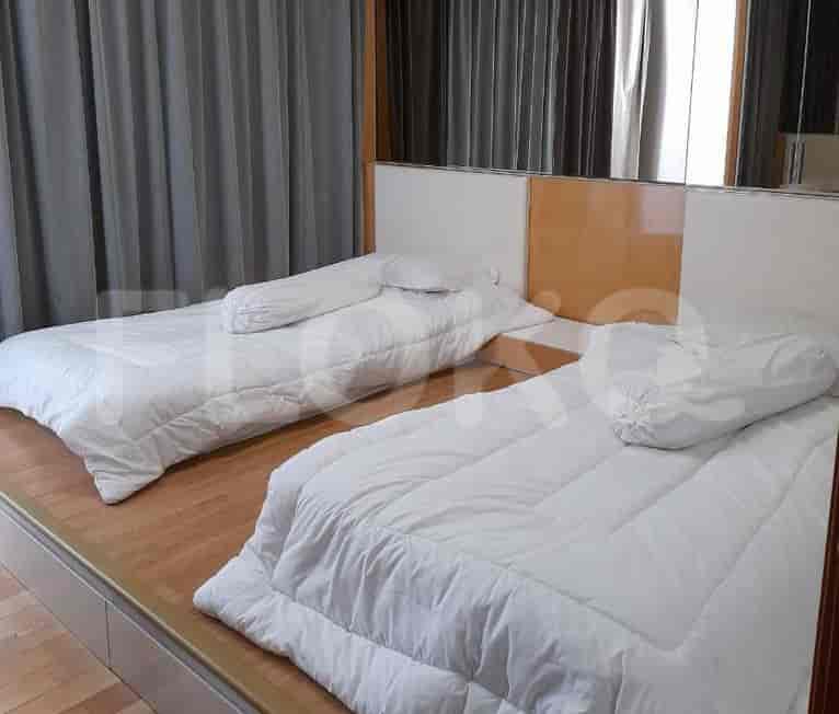 Kamar tidur kembar dengan dua tempat tidur.