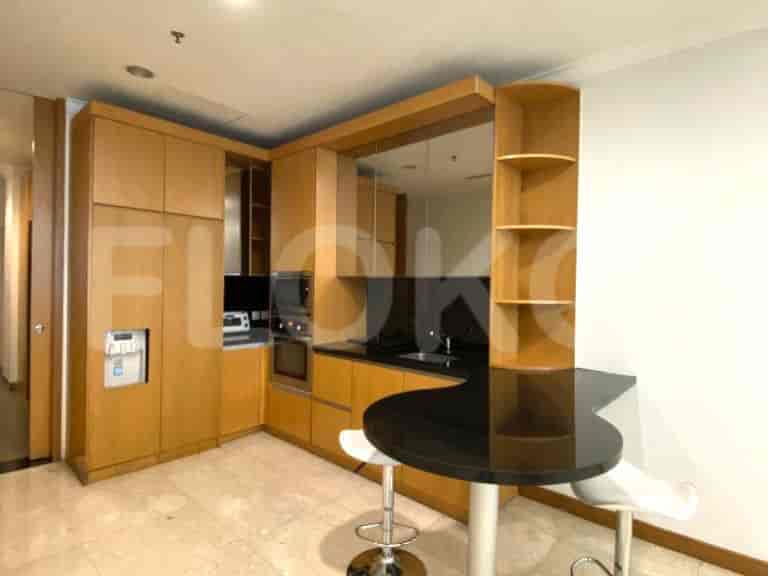 Modern kitchen with built-in appliances and a breakfast bar.