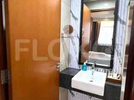A bathroom with sink and mirror.