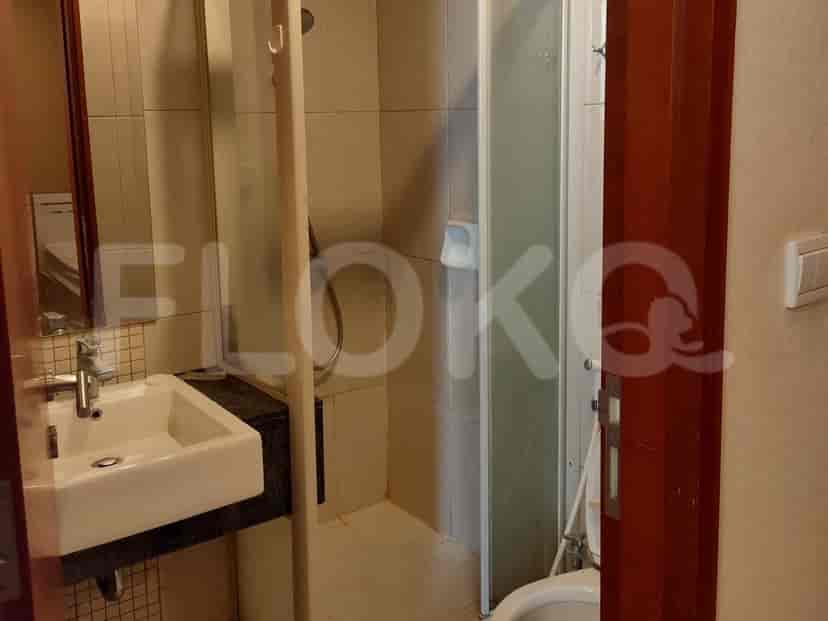 Bathroom featuring a sink and shower area.