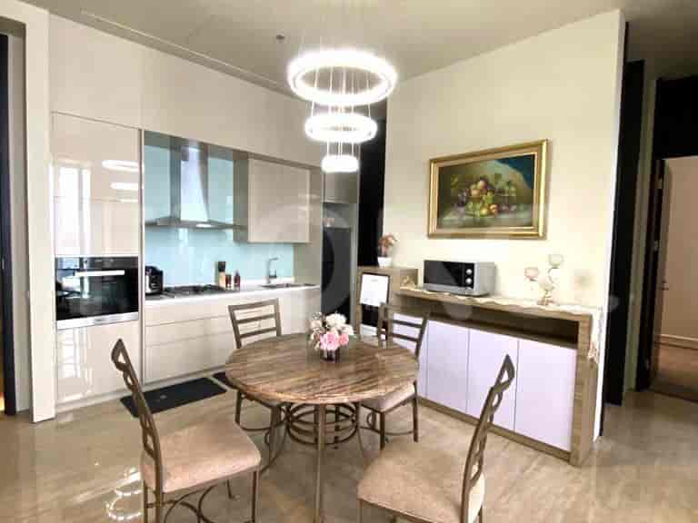 Modern kitchen with a dining area, featuring a round dining table.