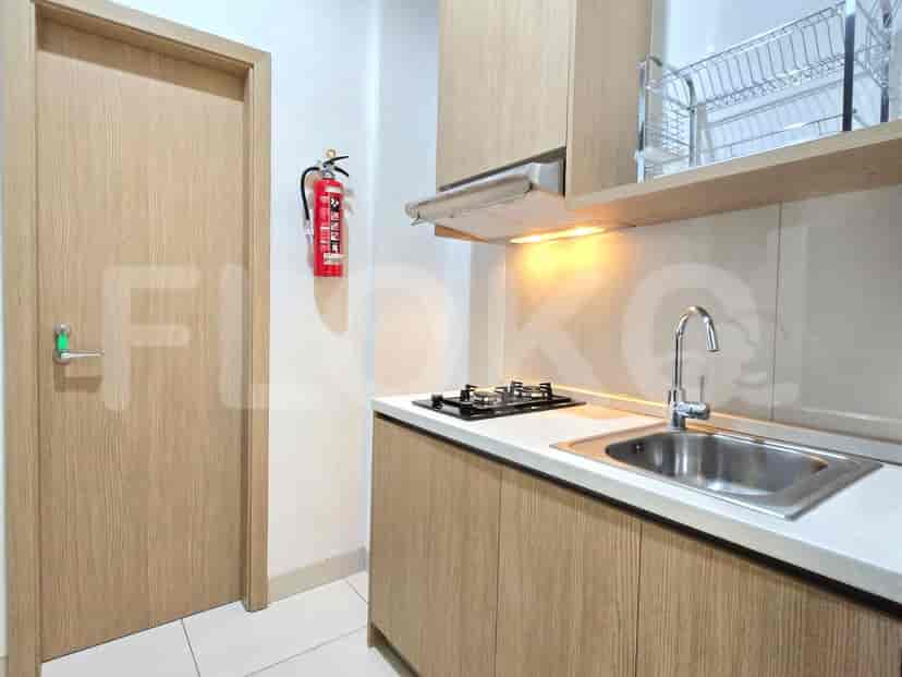 Kitchen showing a small stove and fire extinguisher.