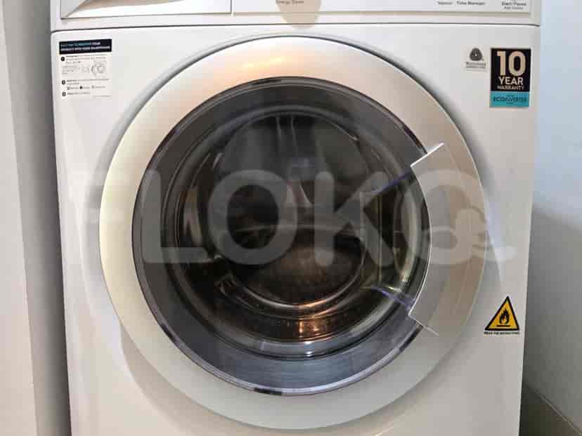 Washing machine in a utility room.