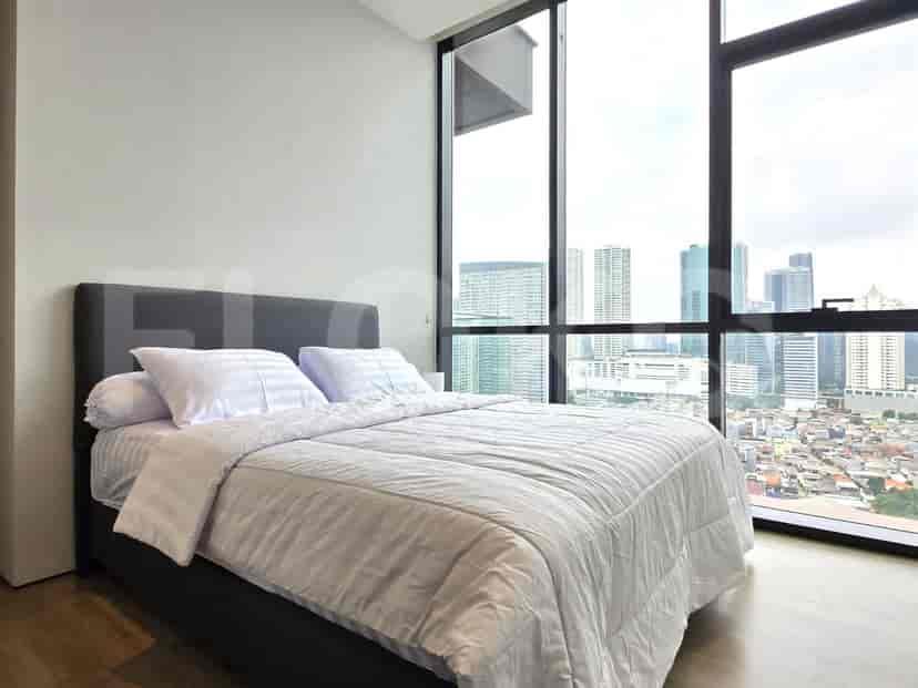 Bedroom with a bed, featuring a city view.