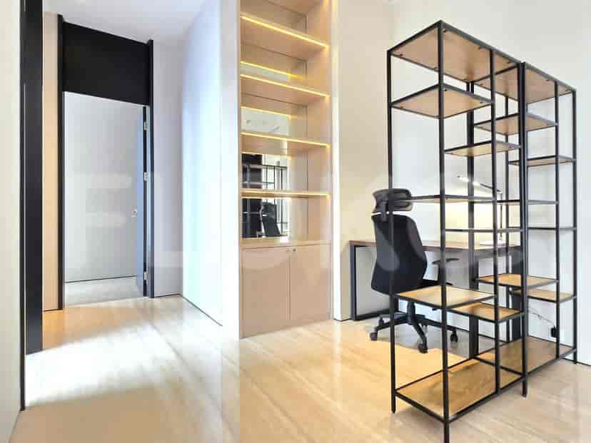 Office space with shelving and desk.