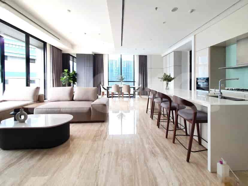 Dining area adjacent to the kitchen island, featuring a table and chairs.