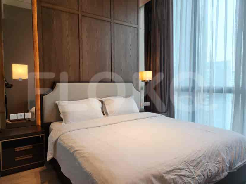Elegant master bedroom with a king-size bed, bedside lamps, and modern design.