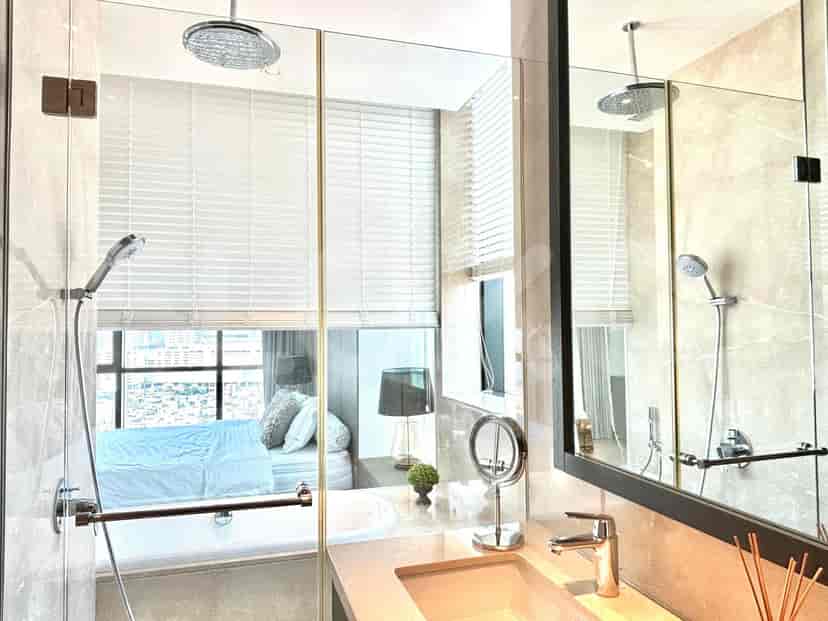 A modern bathroom with a toilet and a bidet.