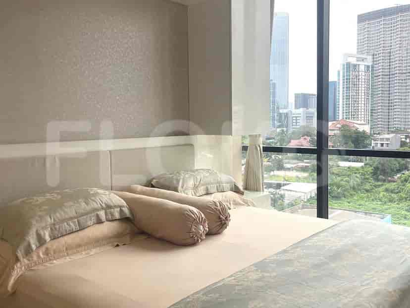 Bedroom with a large bed and city view.