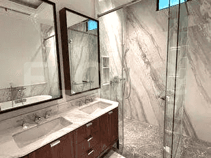 A close-up of the bathroom with the bathtub, toilet, and shower.