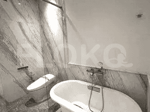 A view of the bathroom, including the shower and sink.