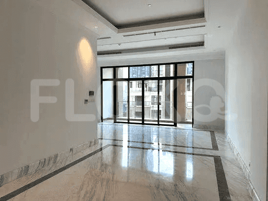 An empty modern living space with large windows and marble flooring.