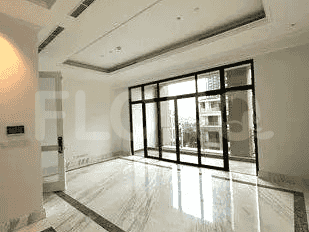 Another angle of the living room, showcasing the windows and marble floors.