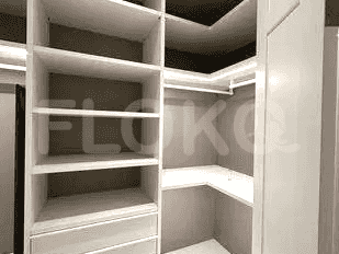 A view of the walk-in closet with shelves and a hanging section.