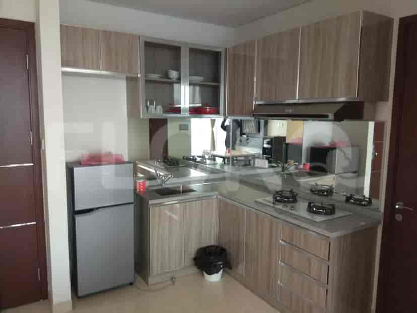 Kitchen with cabinets, appliances, and a counter.