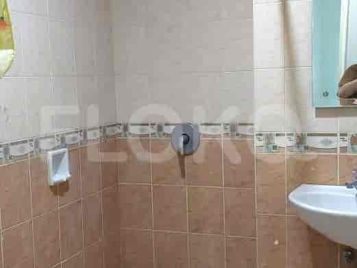 Tiled bathroom with a shower.
