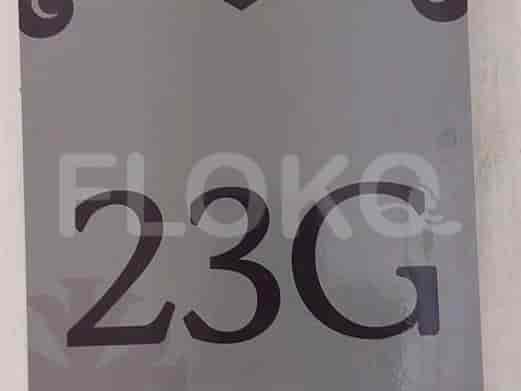 Close-up showing the apartment number '23G'.