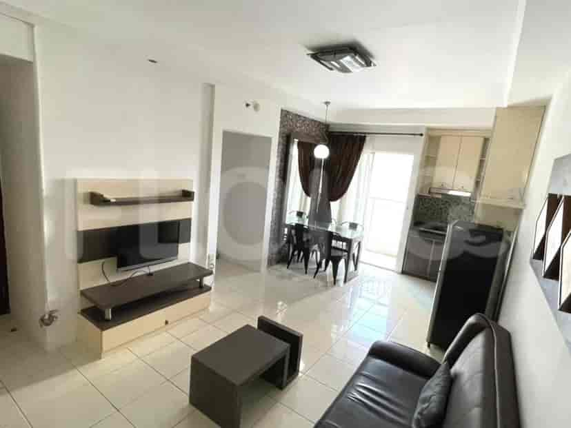 A view showcasing the living room, dining area, and kitchen layout.