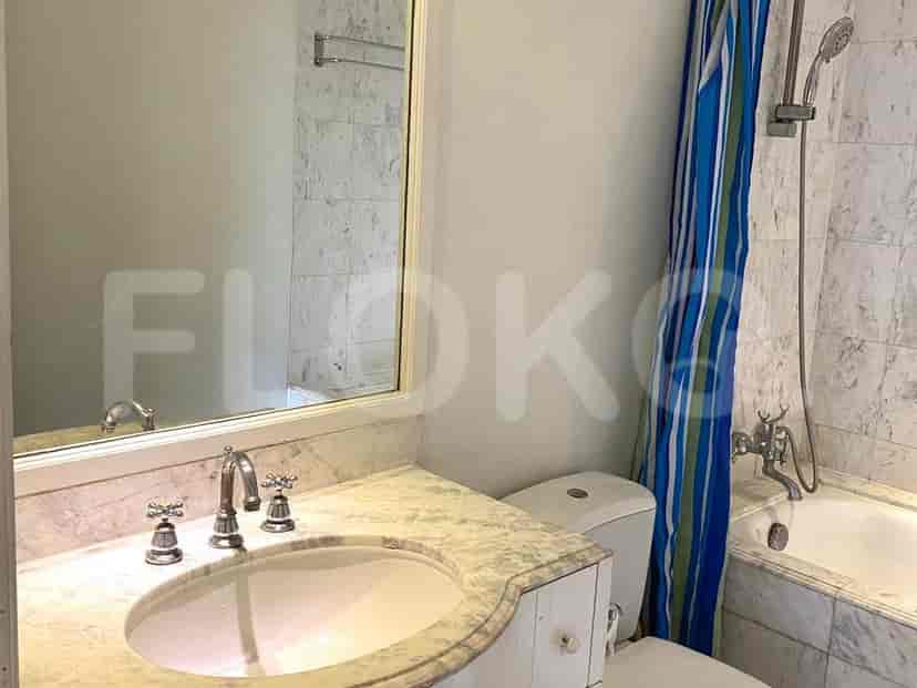 A bathroom with a sink, toilet, and a shower.