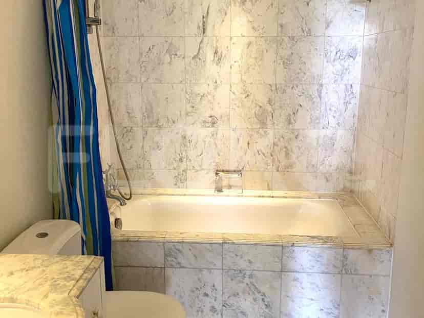 A bathroom with a toilet, shower and tub.