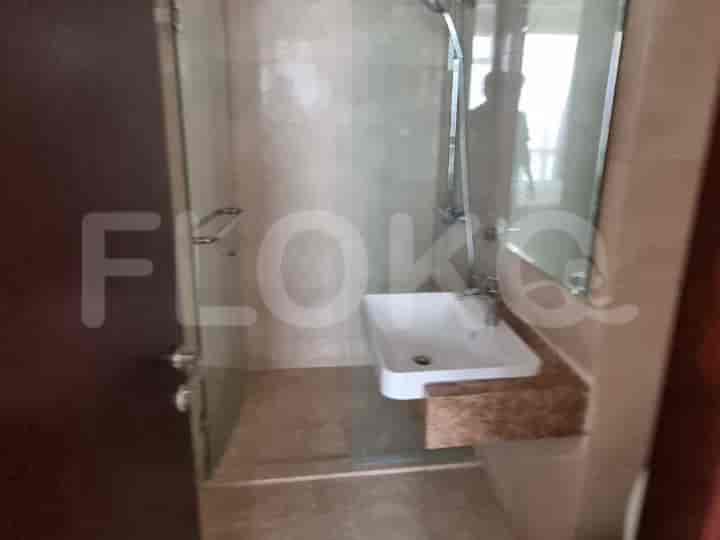 A bathroom with a shower, a sink, and a mirror.