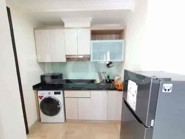 A compact and well-equipped kitchen with modern appliances.