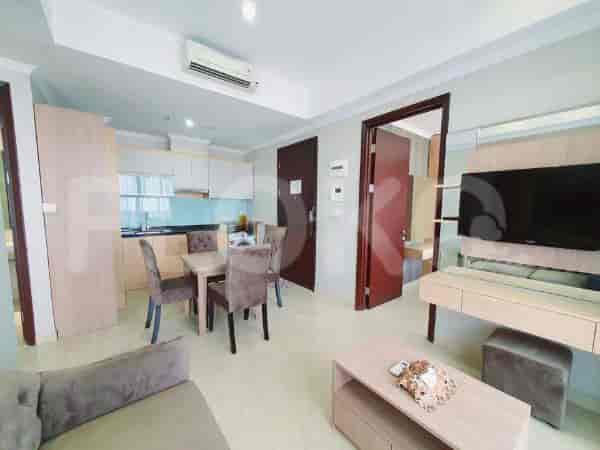 A cozy bedroom with a double bed and a stylish backdrop.