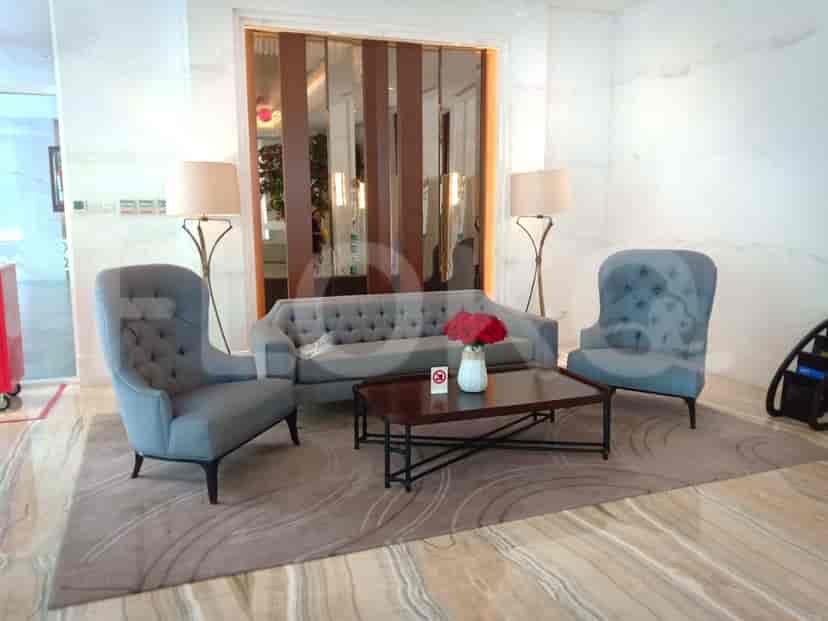 A stylish lobby featuring comfortable seating and decorative lamps.