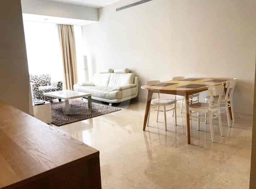 Dining and living area, featuring a dining table with chairs and a living room setup.