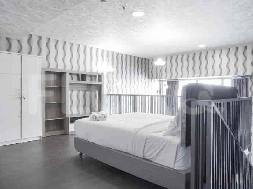 Bedroom with a bed, closet and modern design.