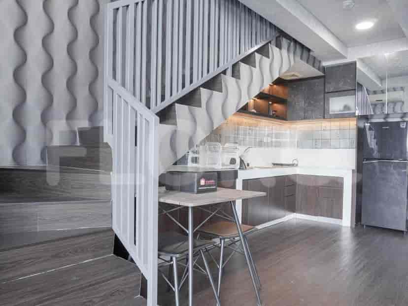 Kitchen with a dining table and stairs