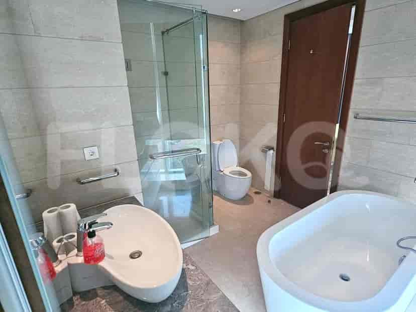 A modern bathroom with a bathtub and a walk-in shower.