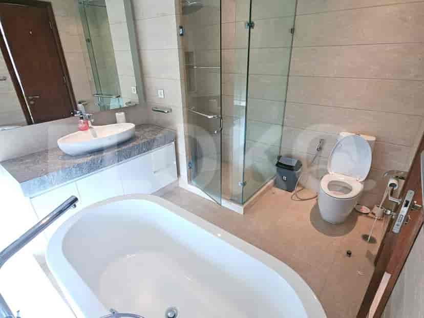 A modern bathroom with a bathtub and a walk-in shower.