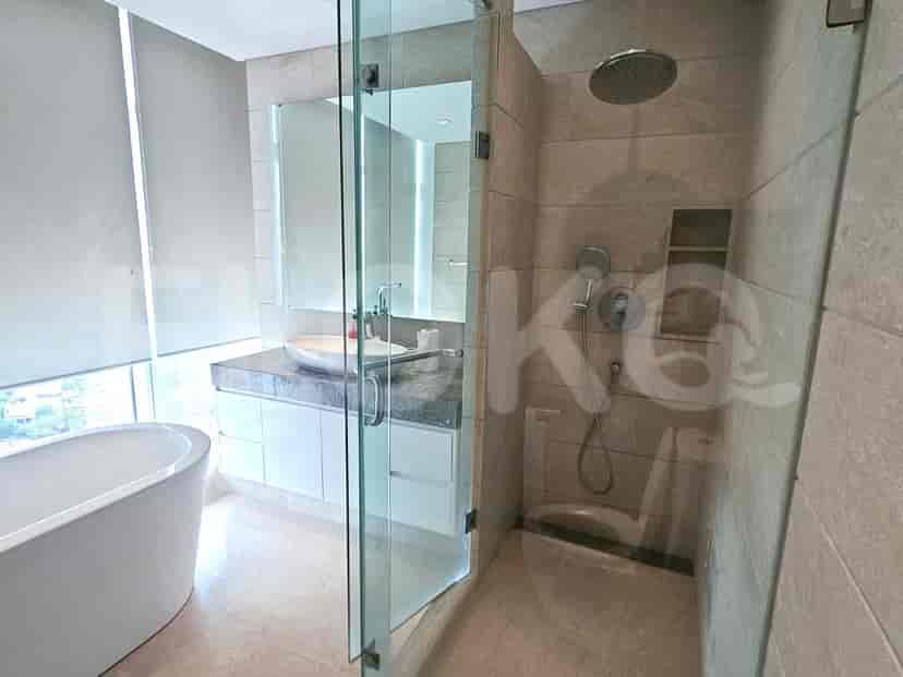 A modern bathroom with a bathtub and a walk-in shower.