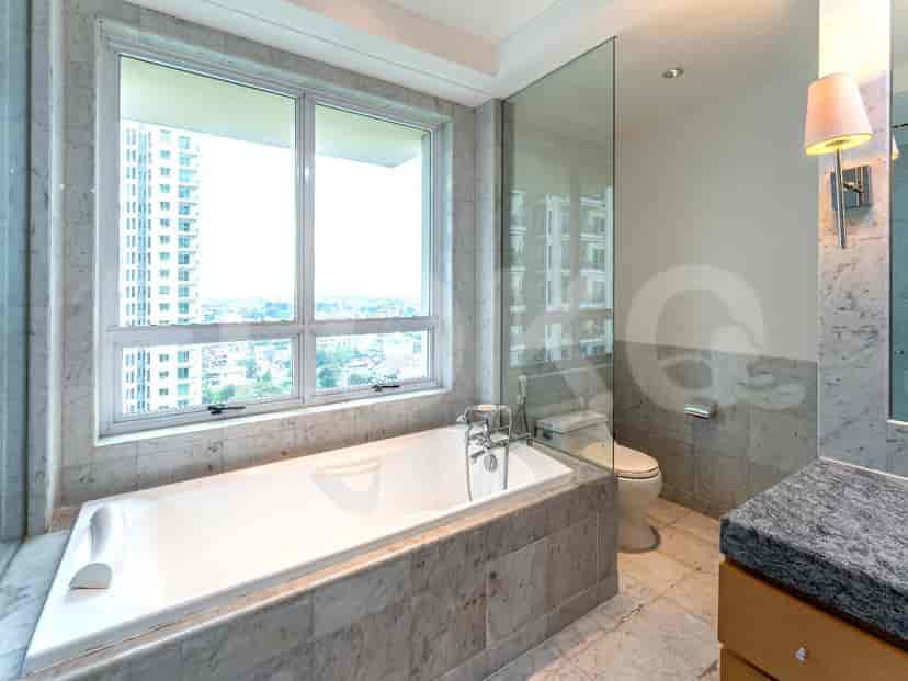 Luxurious bathroom with a bathtub and marble detailing.