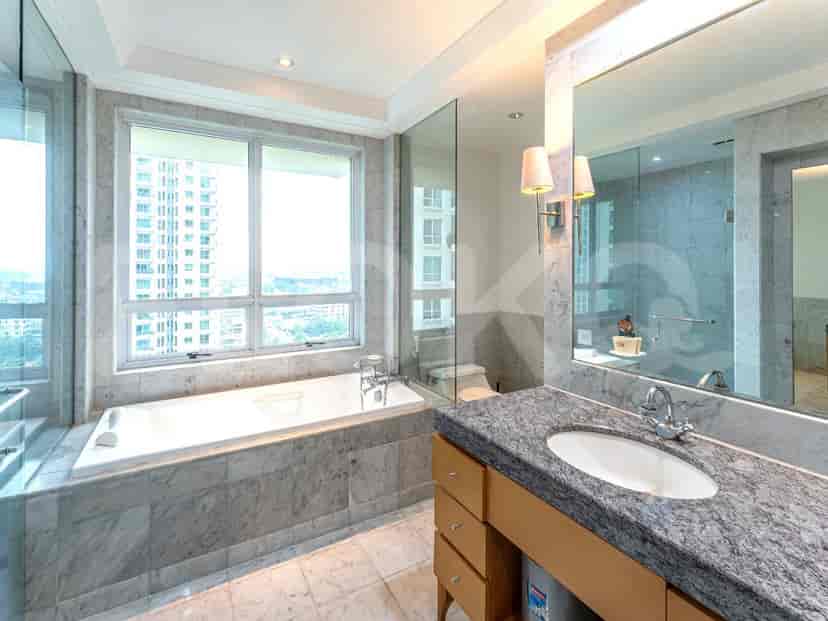 Bathroom with a bathtub and a view.