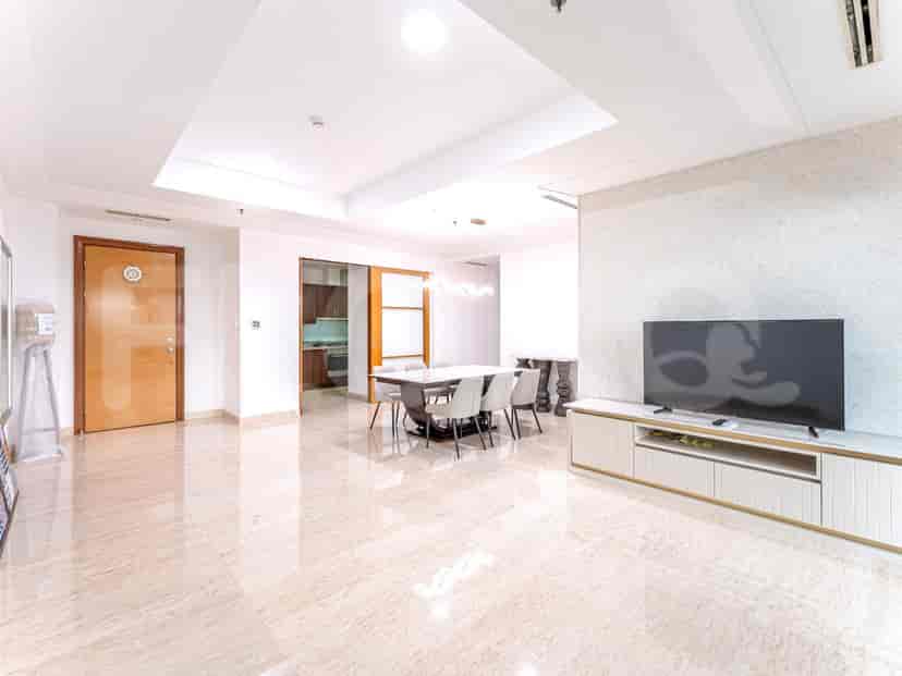 Spacious living area with marble flooring, dining table, and a TV console.
