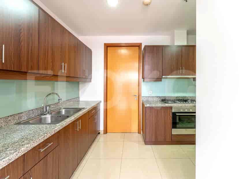 Modern kitchen featuring wooden cabinets and stainless steel appliances.