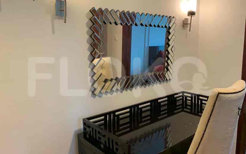 Entrance with a mirror and table.