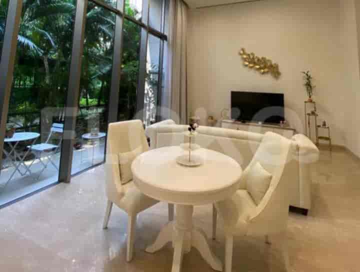 Living room with a dining table and white chairs.
