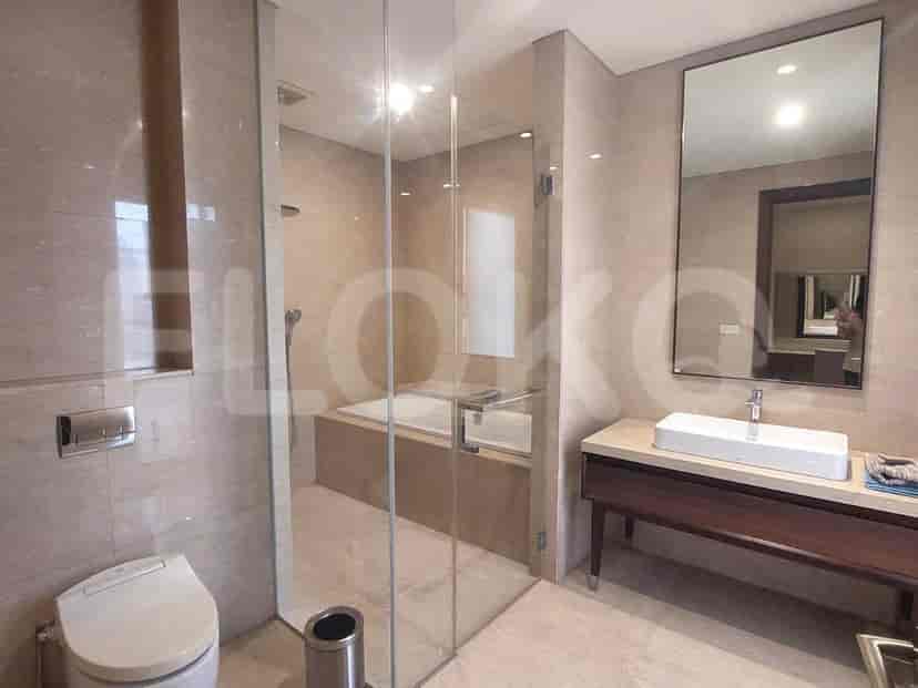 Modern bathroom with a walk-in shower, bathtub, and neutral tones.