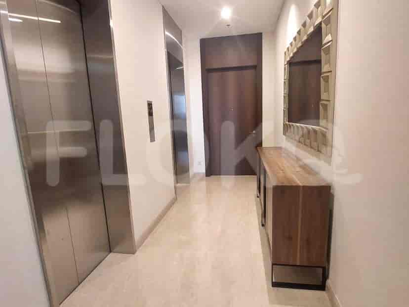 Spacious hallway with marble flooring and access to other rooms.