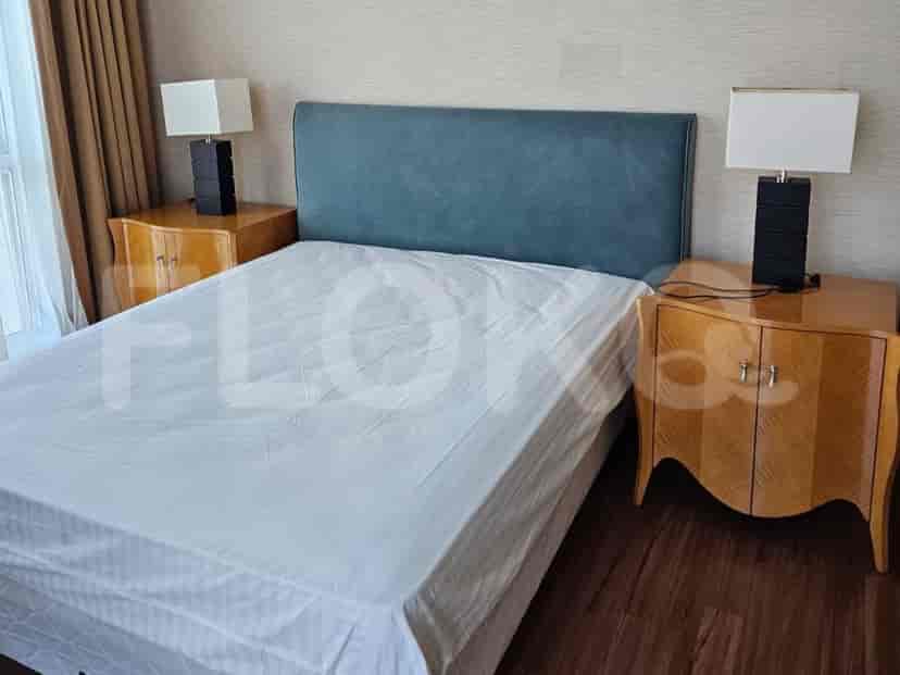 Bedroom with a bed and two nightstands.