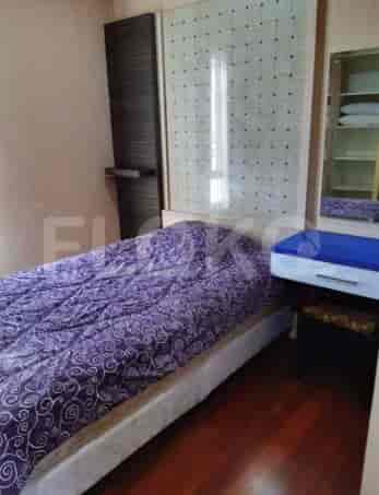 Bedroom with a bed, dresser, and a closet.