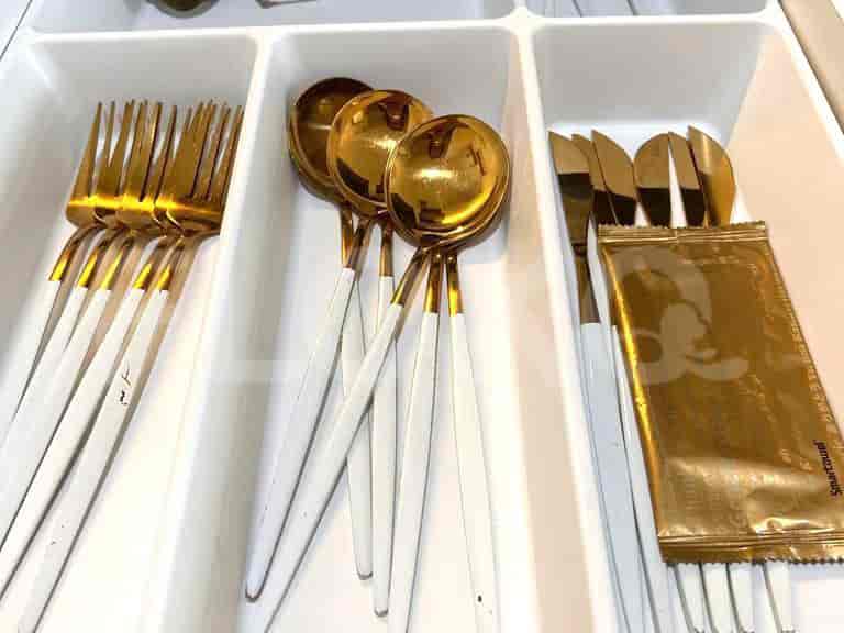 A close-up shot of the cutlery drawer.