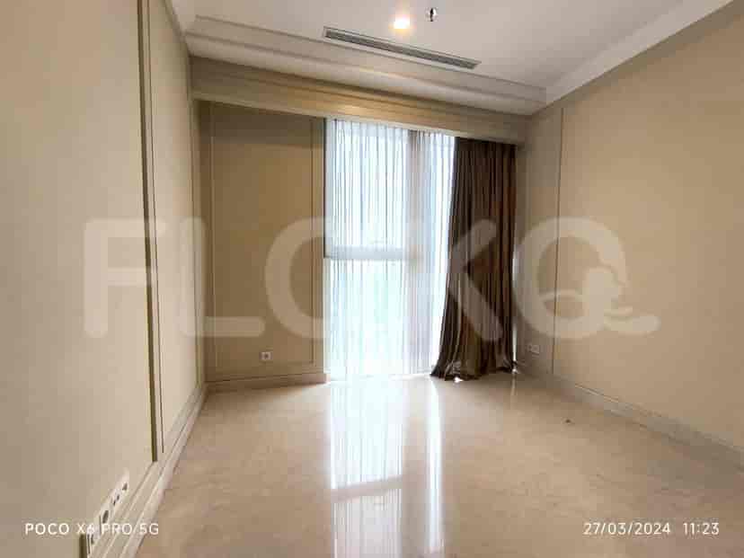 An empty room with a view of the city.