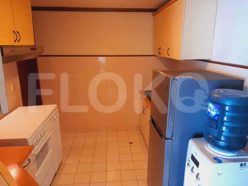 Kitchen with cabinets, a refrigerator, and a stove.