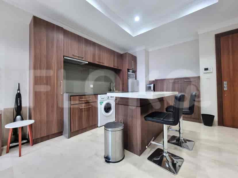 A stylish kitchen with wooden cabinets and a breakfast bar.