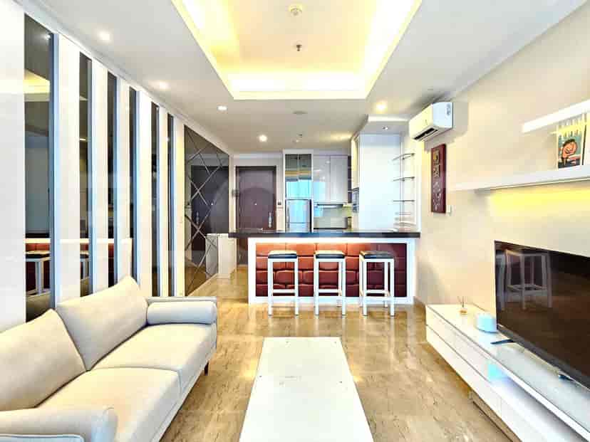 Open layout with a living room area and a kitchen with a bar.
